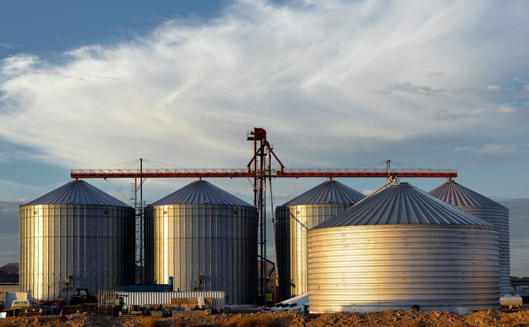 a group of large metal tanks sitting next to each other